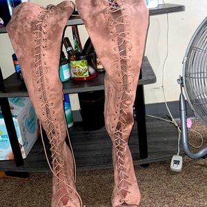 Thigh high lace up boots